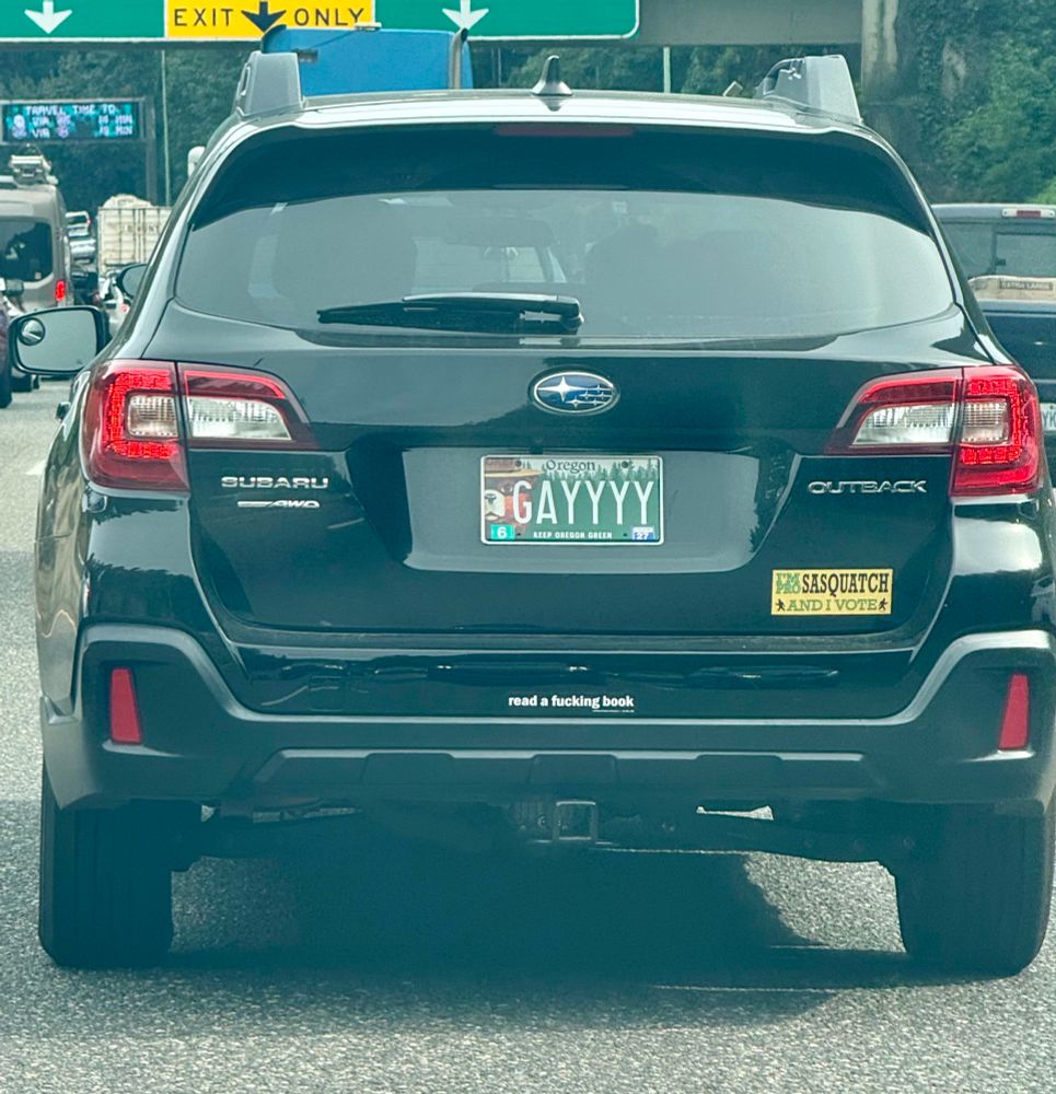 A Subaru with the license plate “GAYYYY”