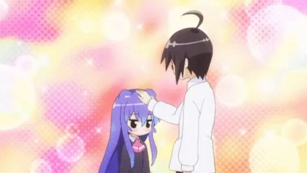 a man is petting a little girl 's head with a cat ear .