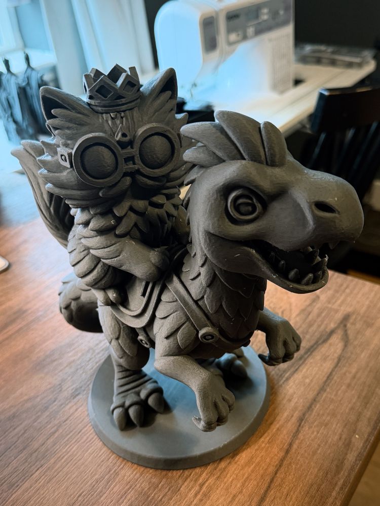 3d print of two characters from the dungeon crawler Carl book series. Princess Donut, cat, riding her pet velociraptor, Mongo. 