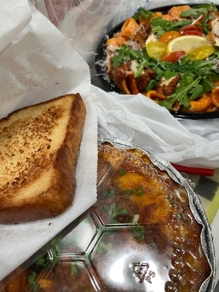 Spicy Italian with breaded chicken cutlet and vegetables, baked Mac and cheese with honey fried chicken, and a slice of Texas toast.