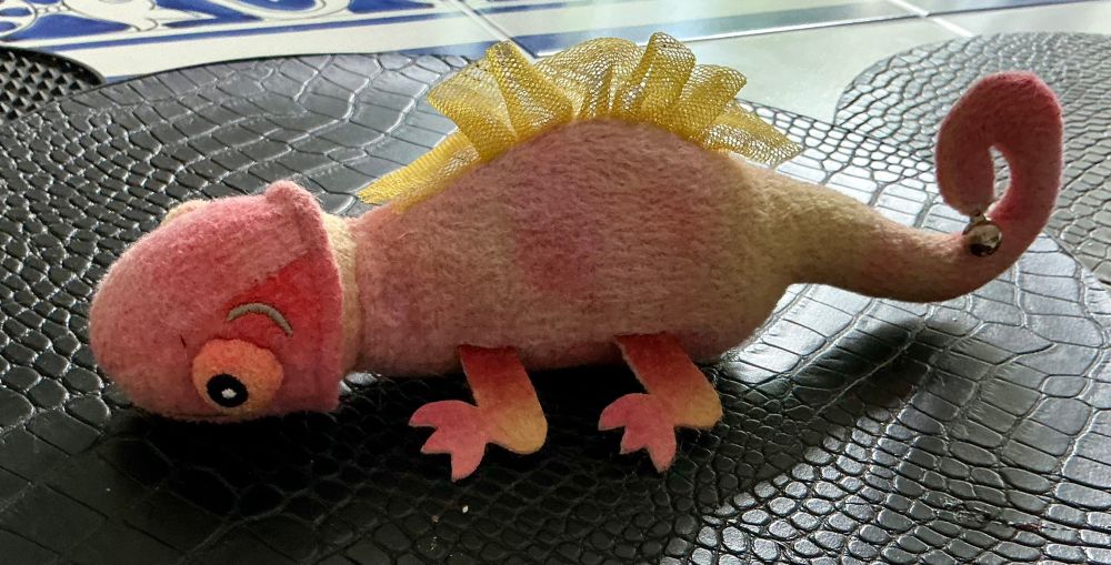 A catnip filled lizard cat toy that does not entirely not look like a penis