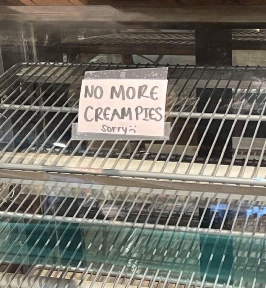 Empty Bakery shelf with sign reading “no more creampies”