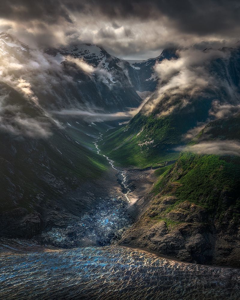 A glacier collapse at its junction with a glacial lake & glacial river, near one of our camps in southern AK. One of the most beautiful valley I’ve seen, captured after the morning fog cleared out.  