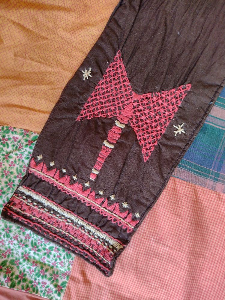 An embroidered sash with Xango two sided axe