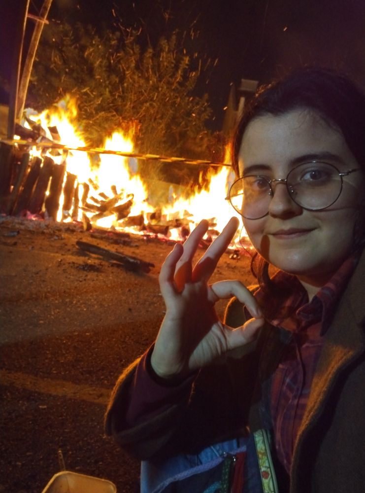 me in front of a HUGE ASS FIRE BUILT IN A CHAPEL'S BACKYARD