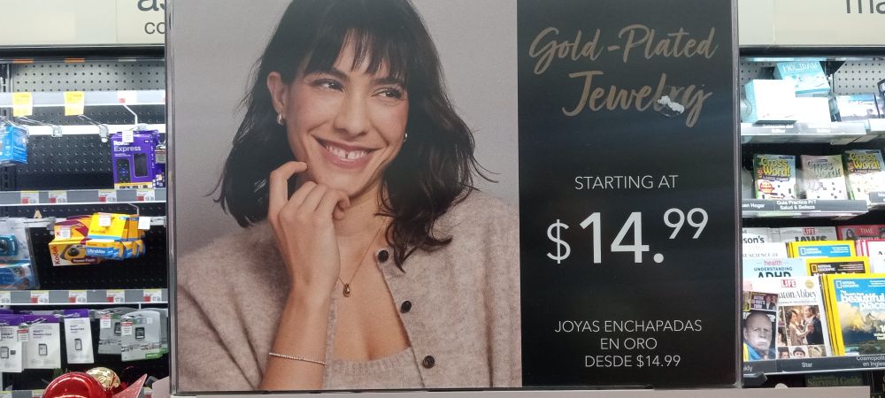 Jewelry display at Walgreens, a dark-haired model with a gap between her front teeth is shown