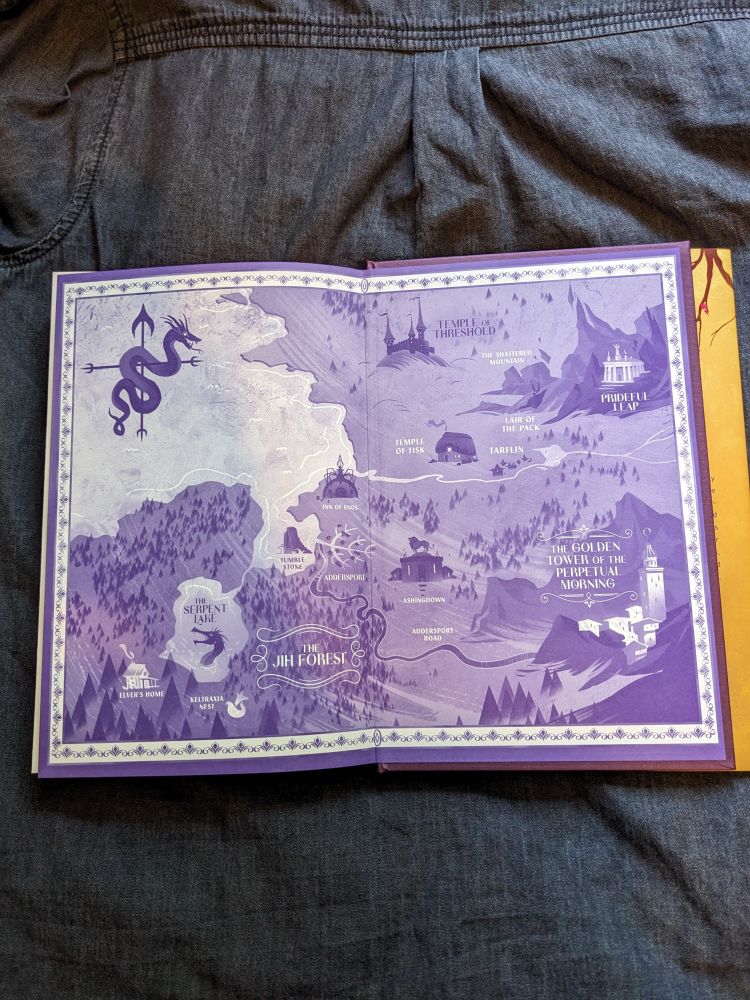 Inner cover of The Sleepless by Jen Williams. In purple, a map of the fantasy land where it's set. Including pictures of dragons!