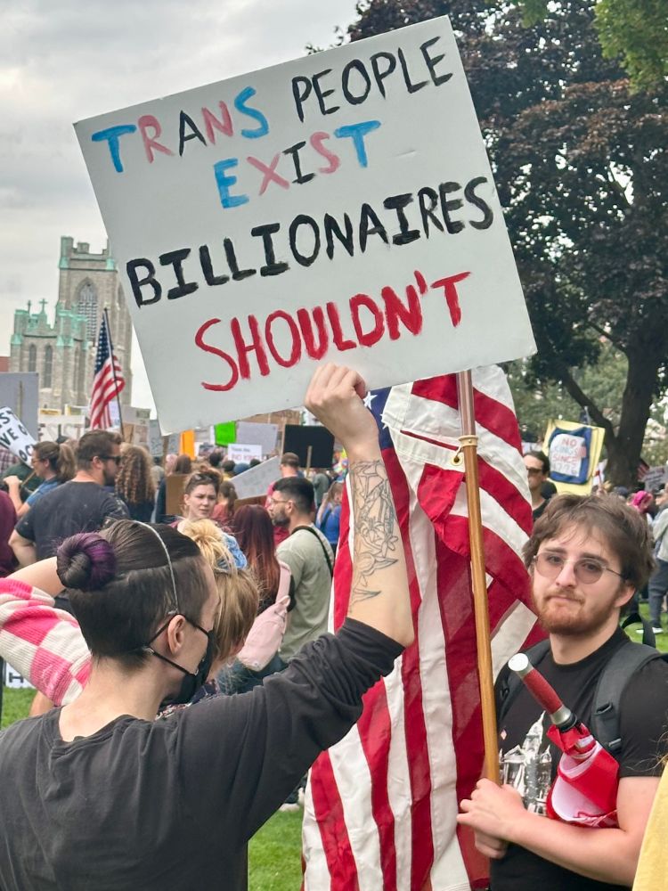 Sign: Trans People Exist. Billionaires Shouldn’t.