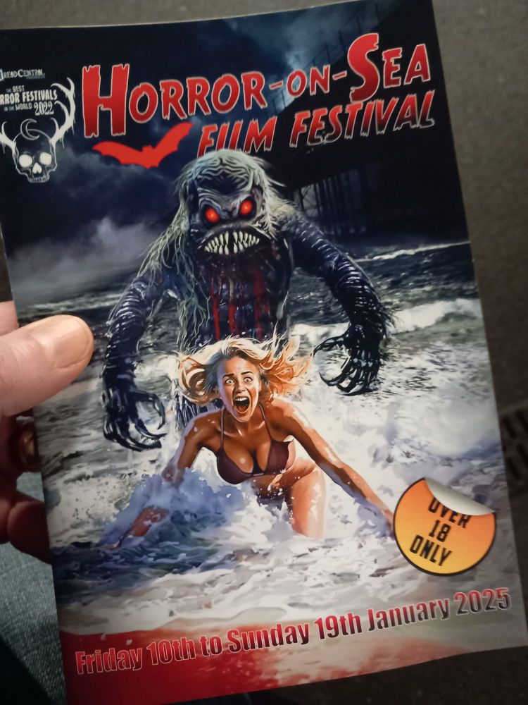 Printed programme for Horror-on-Sea Festival, with a sea monster chasing a girl in a bikini on the cover