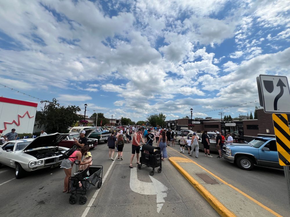 A crowd of people on 50th Avenue, Leduc, Alberta. 