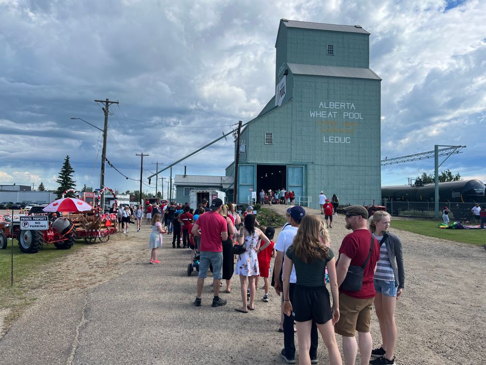 A very long line up for pancakes outside of the grain elevator 