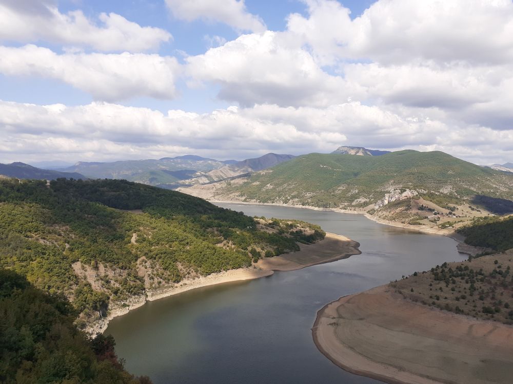 Another picture of the sandy shores on the hills with the river.