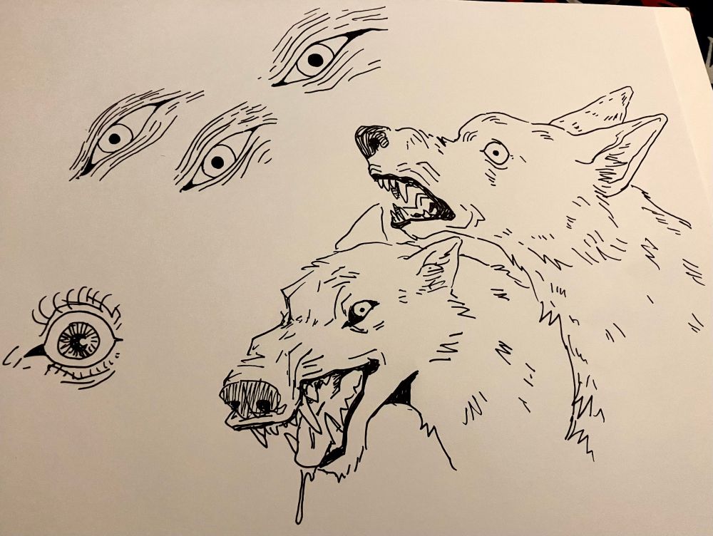 a sketchbook page: some ink drawings of stylized eyes, and two nasty-looking wolves
