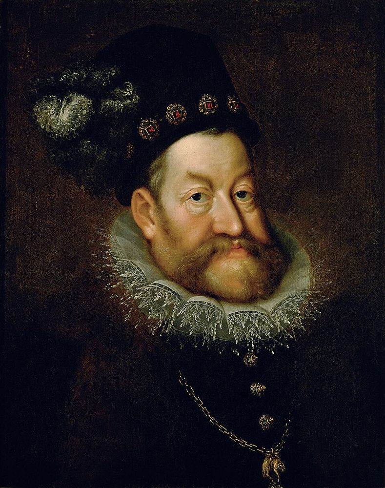 Oil on canvas Portrait of Holy Roman Emperor, Rudolf II by Hans von Aachen, c. 1607, which is now in the Kunsthistorisches Museum, Vienna. Rudolf wears a bejeweled black hat topped by a feather and a fashionable lace ruff over his black jacket. Around his neck he wears the toson d'or, the symbol of the chivalric order of the Golden Fleece. 