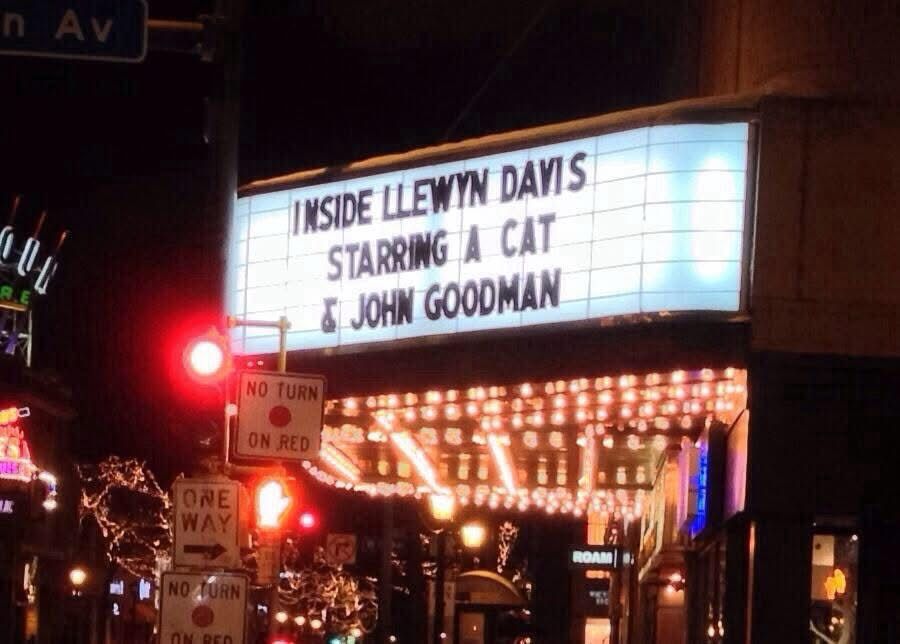 A movie marquee 

INSIDE LLEWYN DAVIS
STARRING A CAT
& JOHN GOODMAN