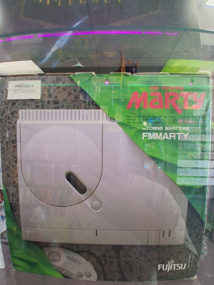 An image of an FM Towns Marty box inside a game shop display