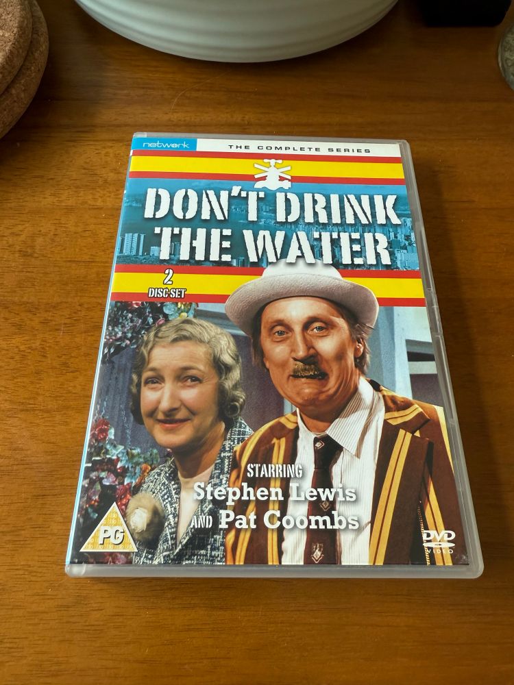 A DVD of “Don’t drink the water” starring Stephen Lewis and Pat Coombes.