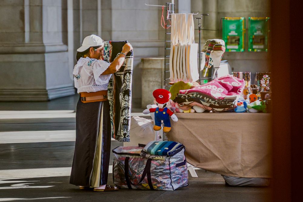 A merchant folding a blanket set to the song “Dopamine” by Robyn. 