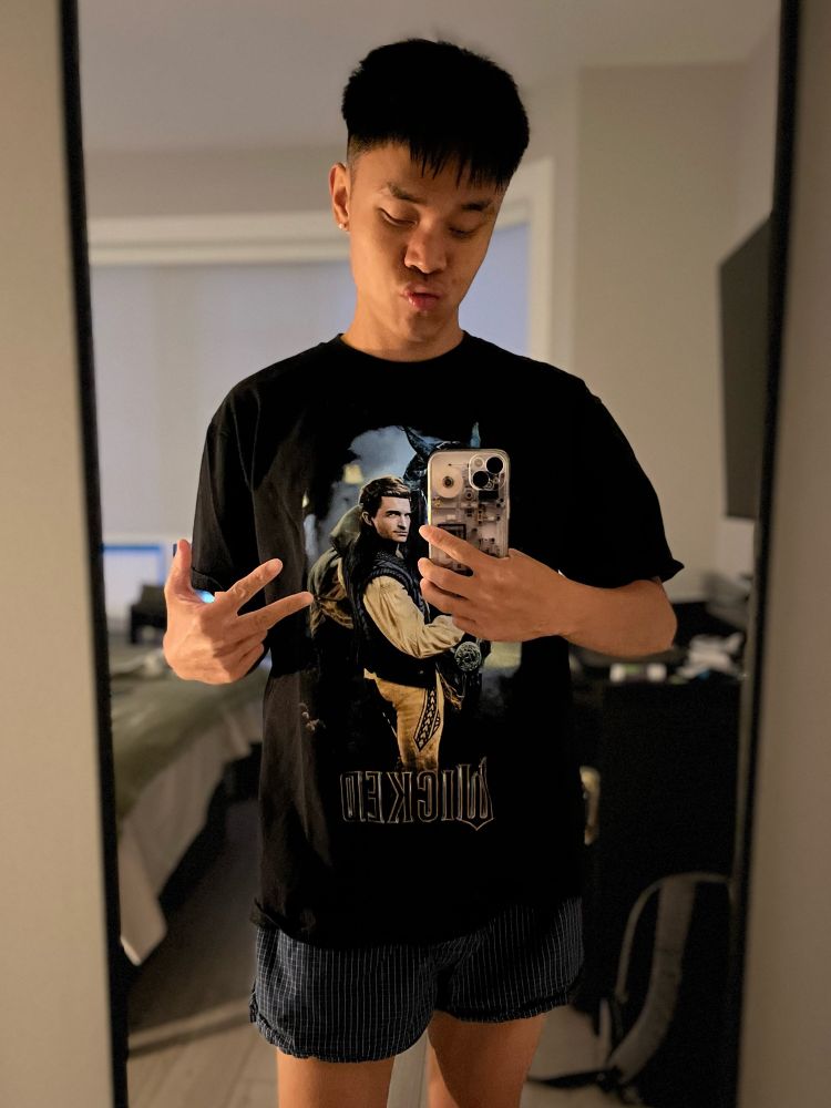Brandon got a new questionable haircut but he’s also in a black Fiyero graphic tee and wearing blue plaid boxers!