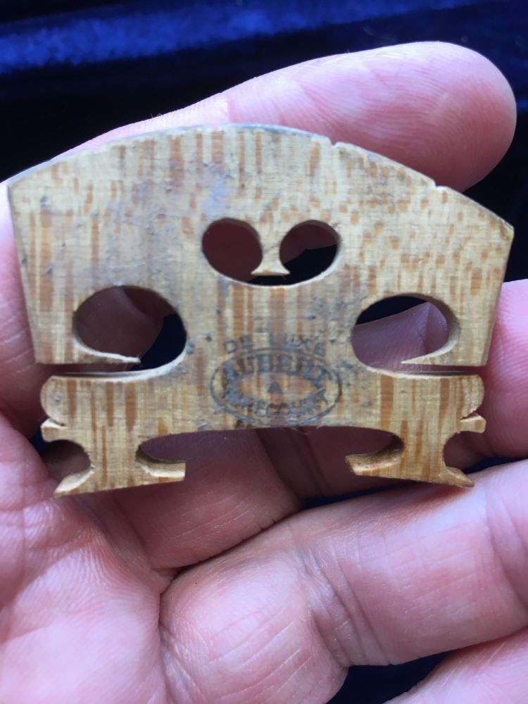 Violin warped bridge replacement.

The old bridge
