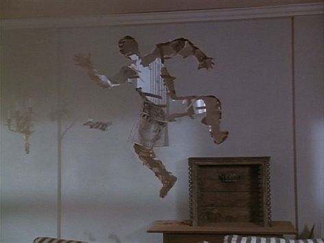 A cartoonish hole through a wall in the shape of a person 