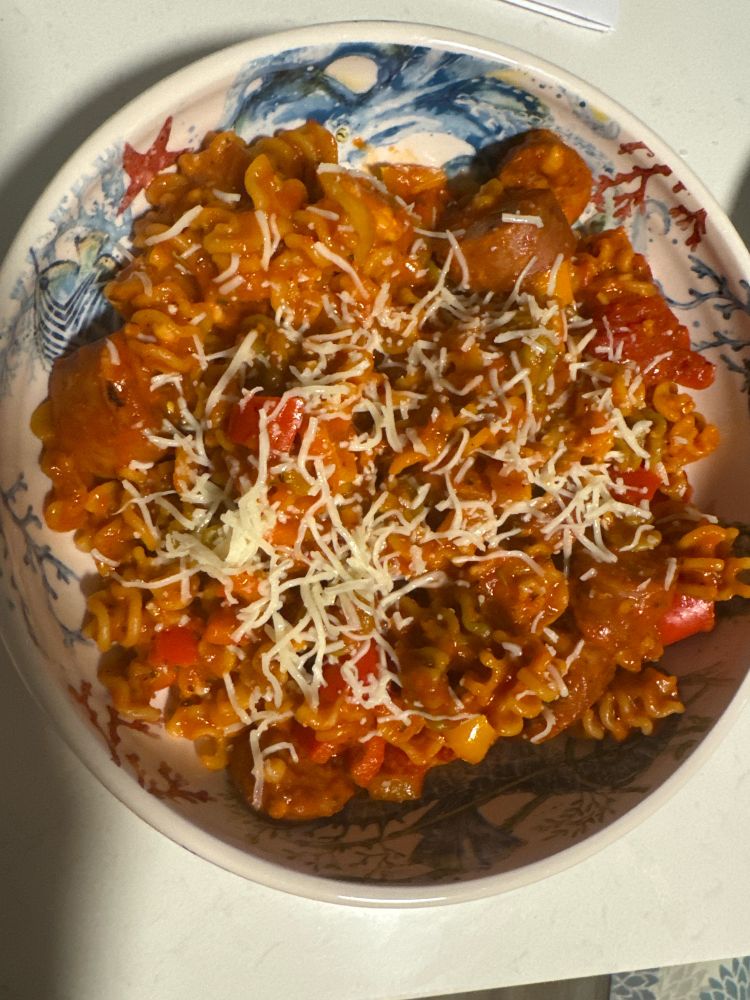 Red bell pepper pasta sauce with sausage and mozzarella. 