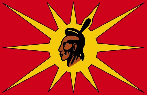 Mohawk Warrior Society Flag
The head of a Mohawk Warrior is in the center of a flag with a red background and yellow sun who's rays stretch to the edges of the flag. 