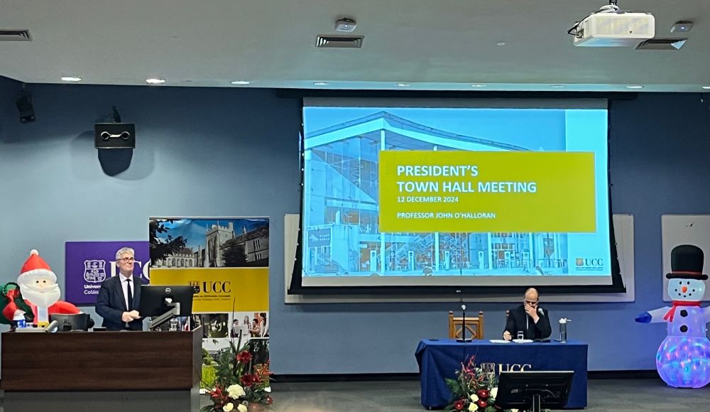 Boole 4 lecture theatre stage at university college cork - President and Bursar sharing stage with  Santa 🎅 and a snowman ⛄️ 