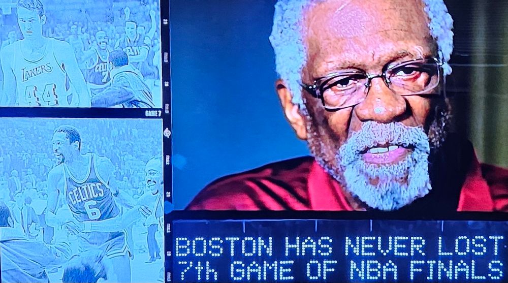 Sign reads "Boston has never lost 7th game of NBA Finals" (Lakers beat Boston in game 7 of 2010 finals when Kobe famously passed Metta World Peace the ball in crunch time and Metta drained the 3)