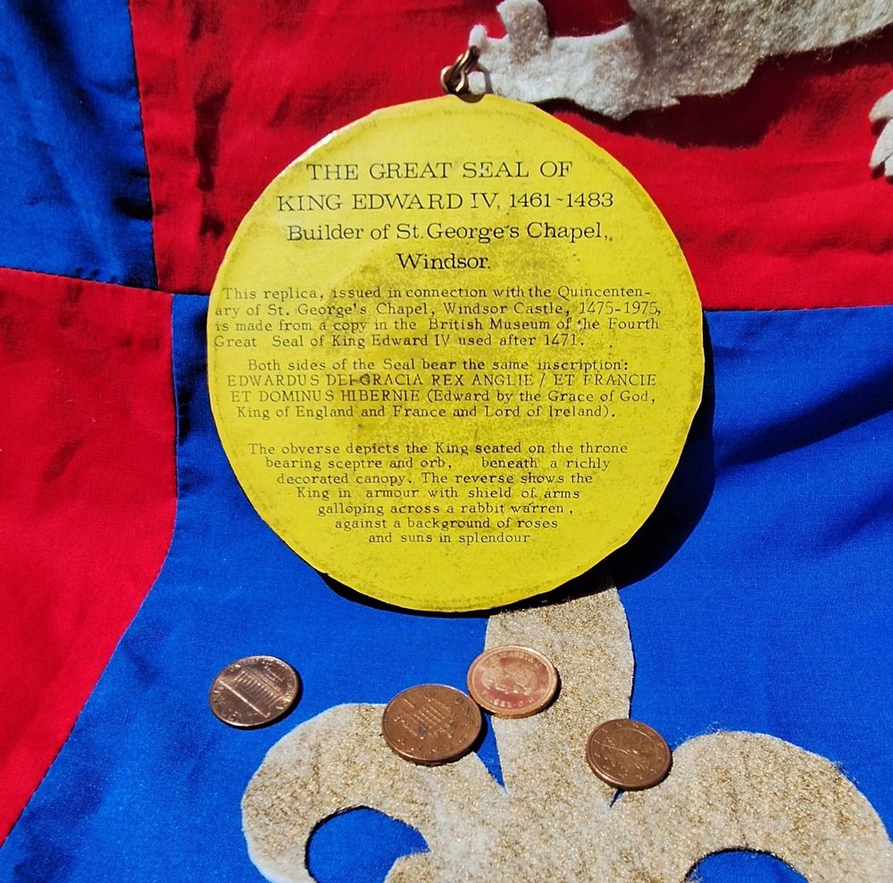 Photo of the back of the seal. It is a printed label explaining what it is, why it was created and describes the various elements of the obverse of the seal.
