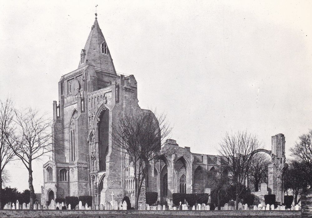 Black and white image from a postcard. Another angle looking through the graveyard towards the church and what is left of the larger abbey.