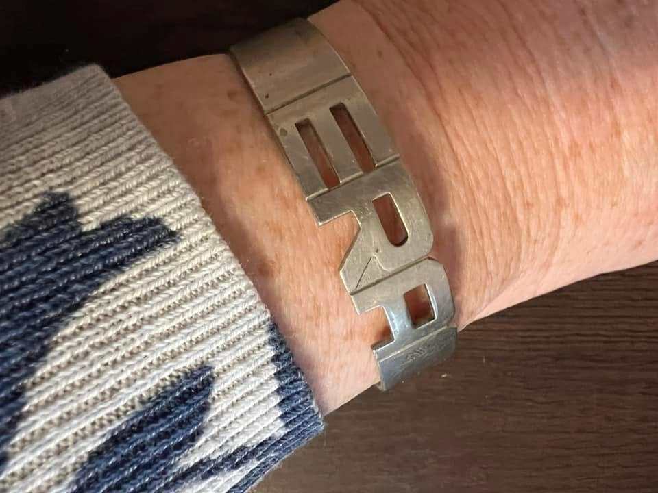 Equal Rights Amendment bracelet on an  arm