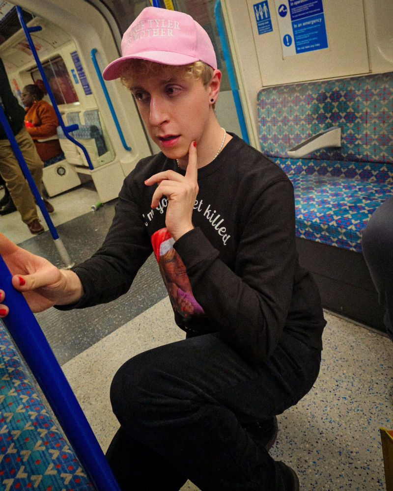 me on the tube wearing a hat that says "jackie tyler is mother"