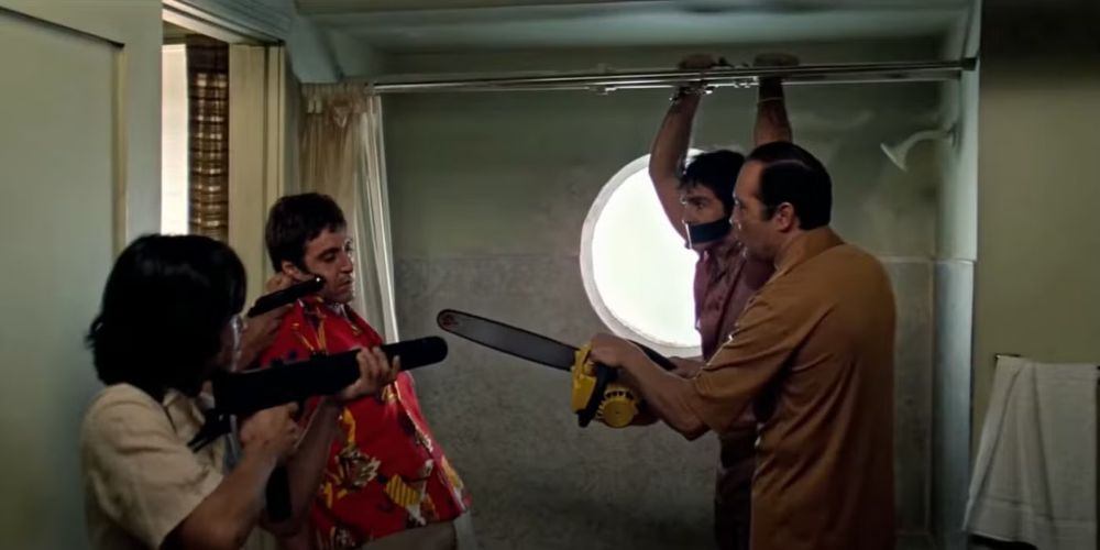 Scarface scene where he is threatened with a chainsaw in a shower.