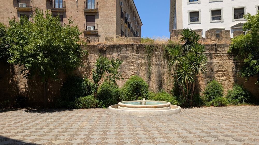 Old almohad city wall in Sevilla, Spain. Plaza del Cabildo
