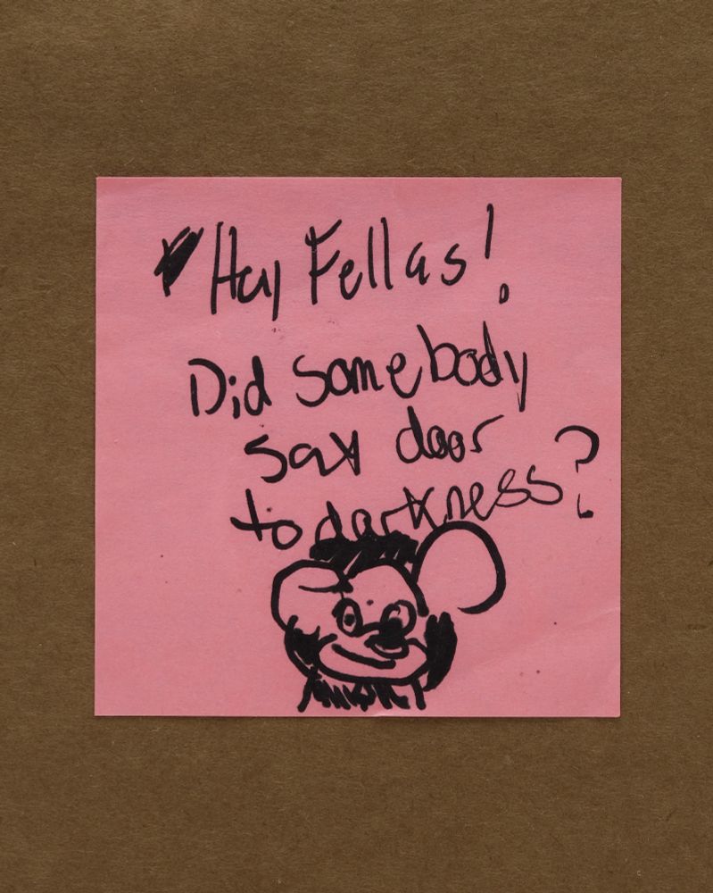 a post-it note that say's "Hey Fellas! Did somebody sat door to darkness?" with a drawing of mickey mouse