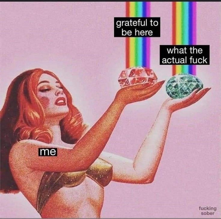illustration of a woman in a gold bralette with her eyes closed as she’s holding two large gems with rainbows shooting out of them, one says grateful to be here and the other says what the actual fuck