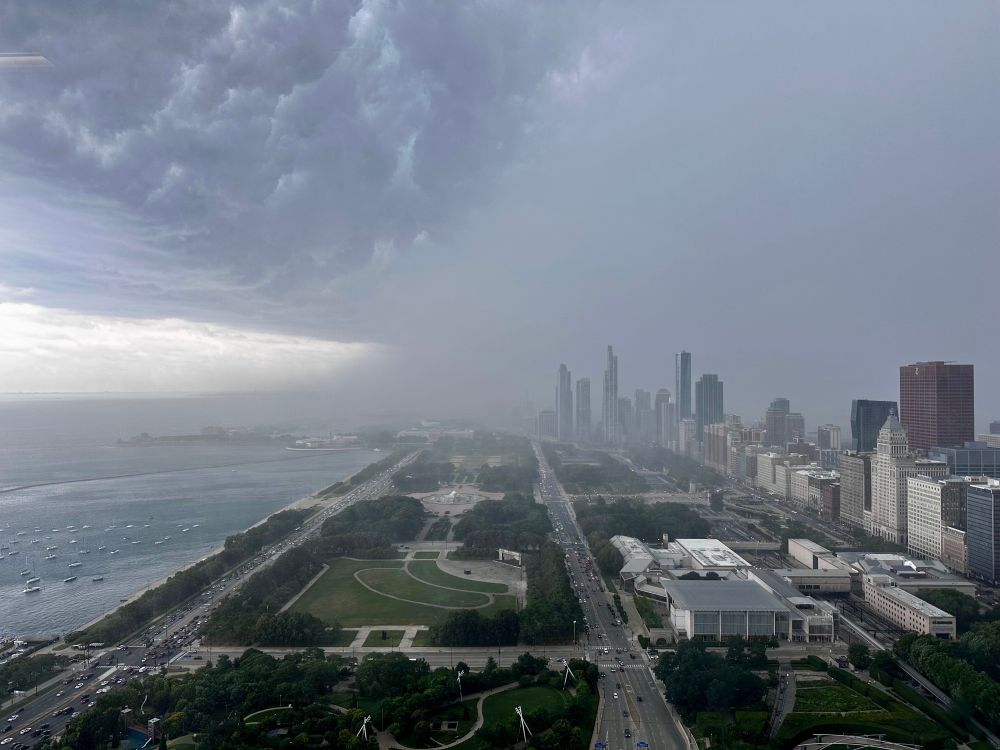 Storm clouds and visible downpour over downtown Chicago. 