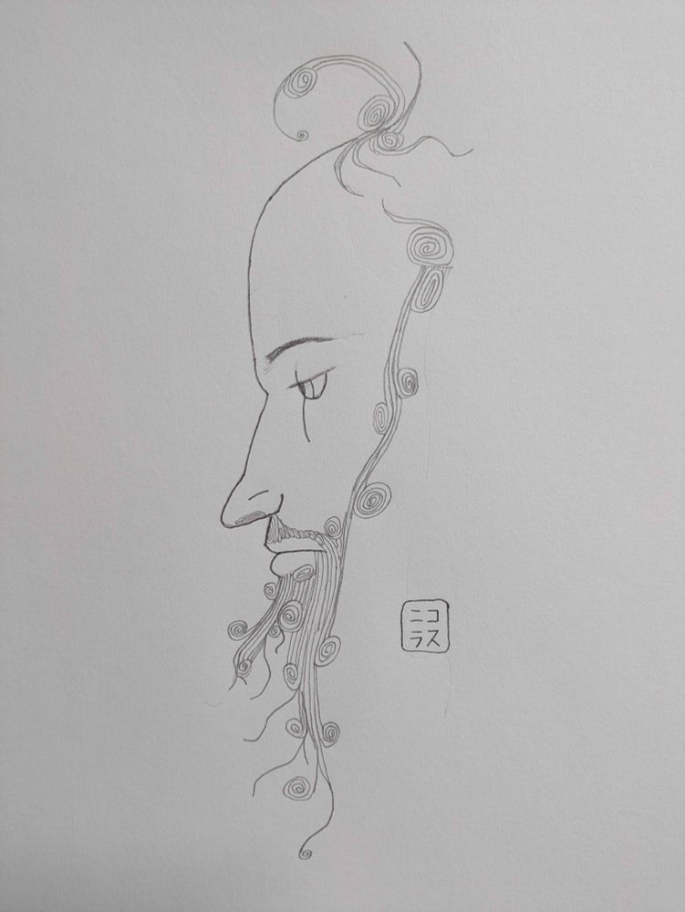 Profile of a middle aged balding man and weirdly curling beard
