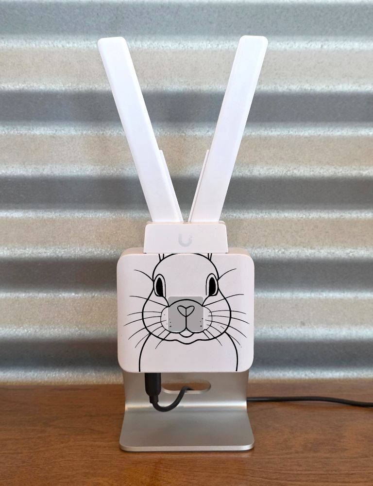 A photo of a Ubiquiti Network's UniFi LTE Mobile Router with rabbit ears.