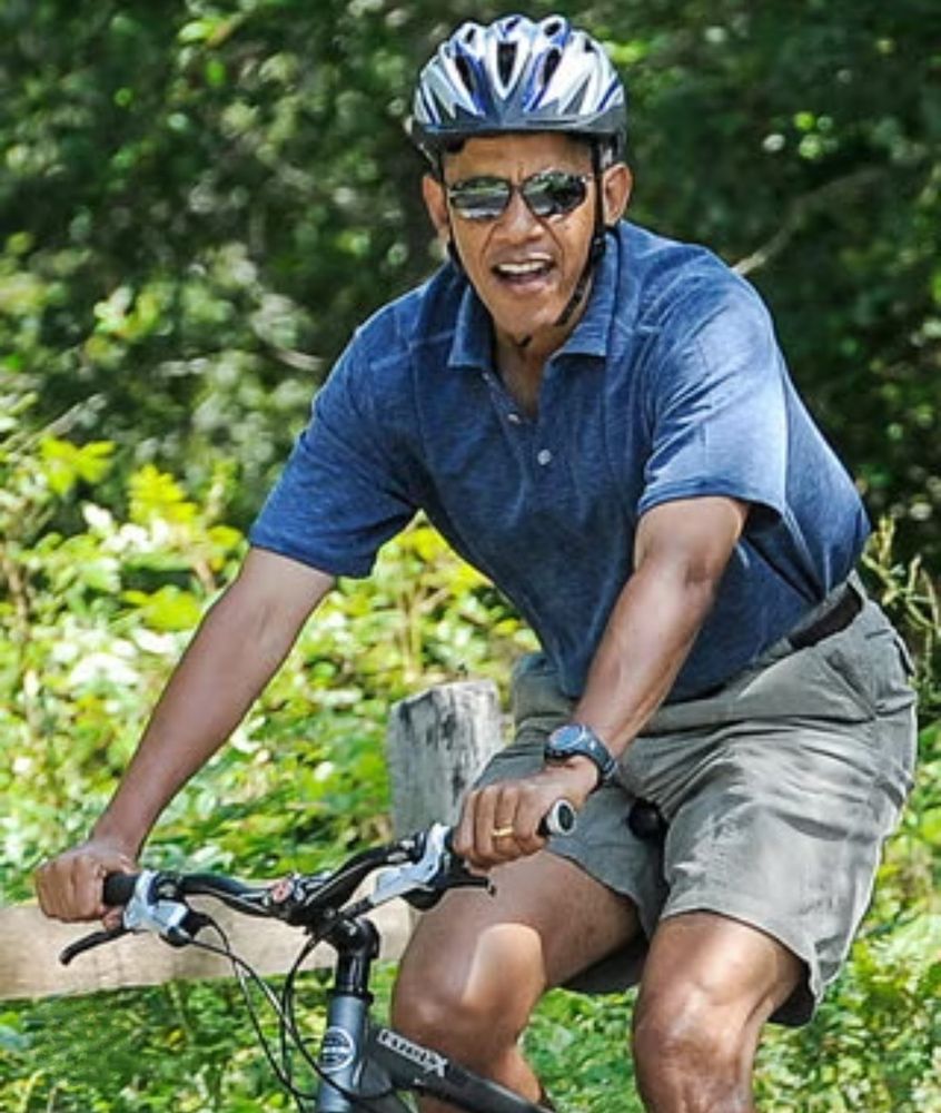 Barack Obama bicycling.