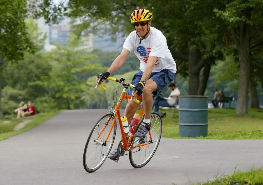 Photo of Joe Biden bicycling. 