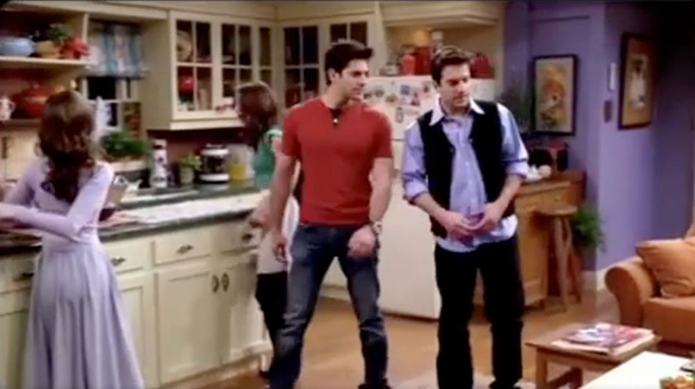 screengrab from the video. the woman on the left has her head on backwards