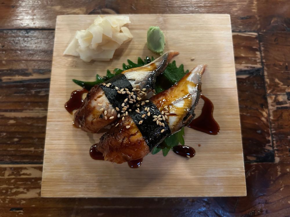 A photo of my unagi sushi ( eel nigiri )