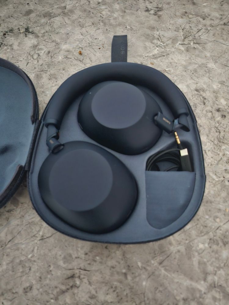 A pair of Sony WH - 1000mx6 headphones in their carrying case. 