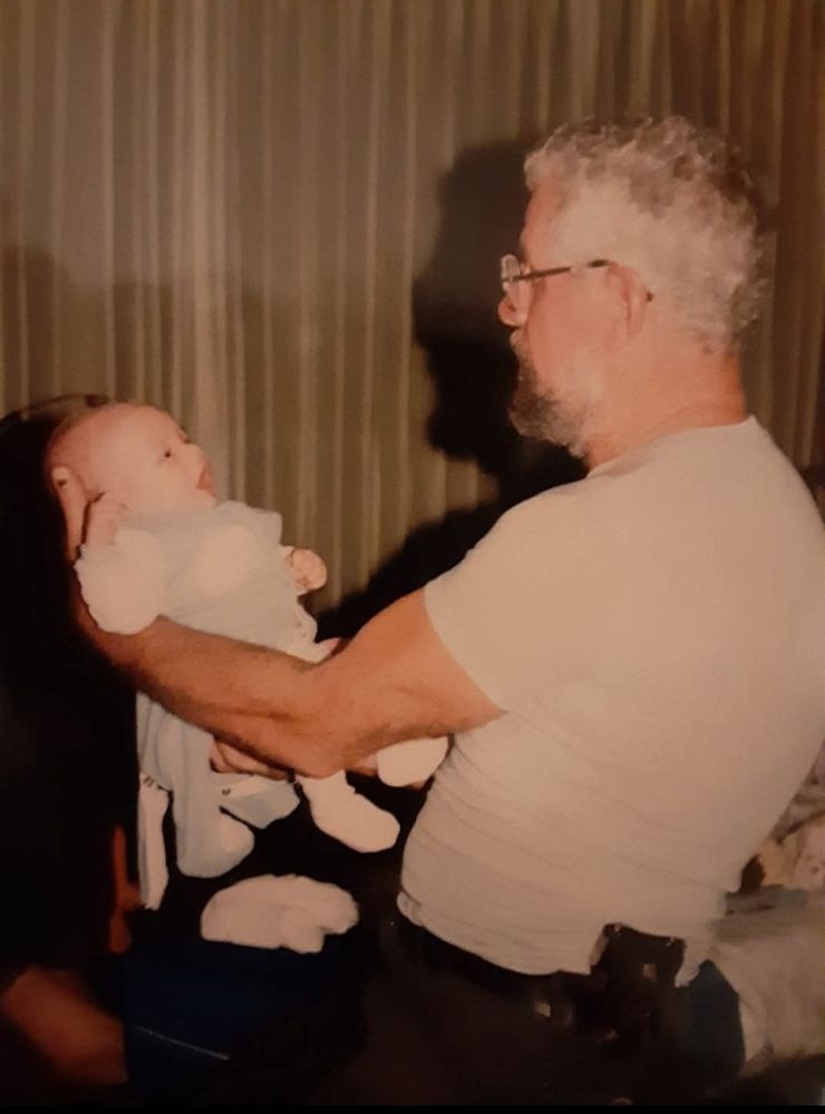 Ca. 1987, yours truly as a baby is held by a bearded man with a 1903 Colt on his belt.  He stunk of kerosene and Gunpowder.  