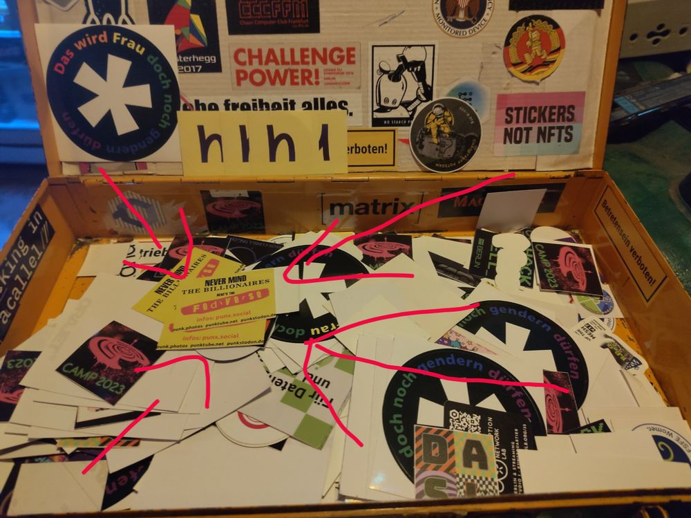 Sticketbox in der cbase mit unter anderem die Nevermind the Fediverse Aufkleber