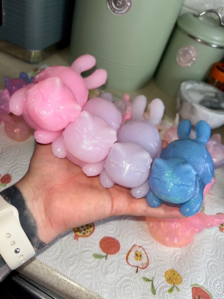 Four comfy kits in my hand; pink, light pink, light purple and blue