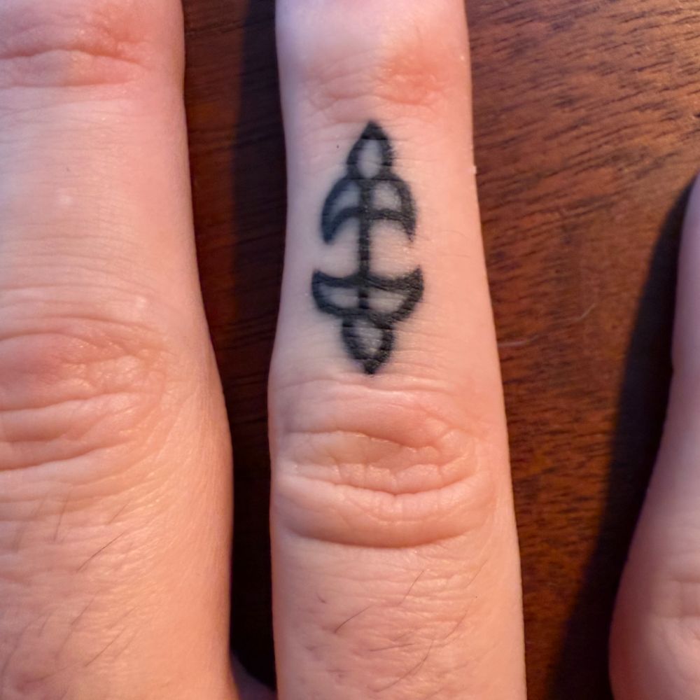 Ice Age Mummy tattoo on finger