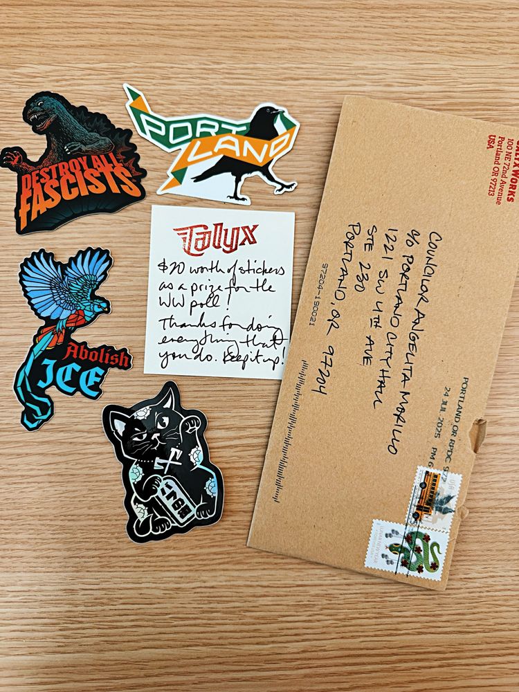 Rad stickers that are colorful and say “abolish ICE” “destroy fascists” crows and a cat. The note attached with the gift says “$20 worth of stickers as a prize for the WW poll! Thanks for doing everything that you do. Keep it up!”